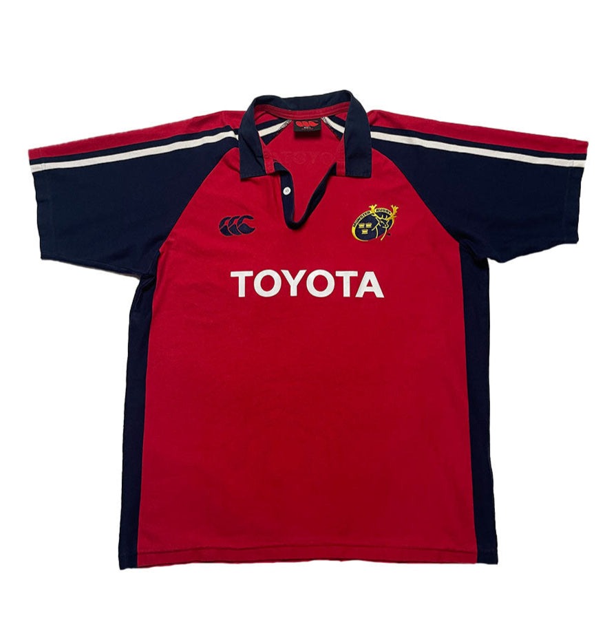 Red and navy polo shirt with Toyota logo on a white background