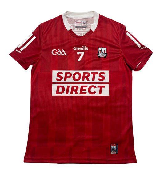Red sports jersey with branding on a white background