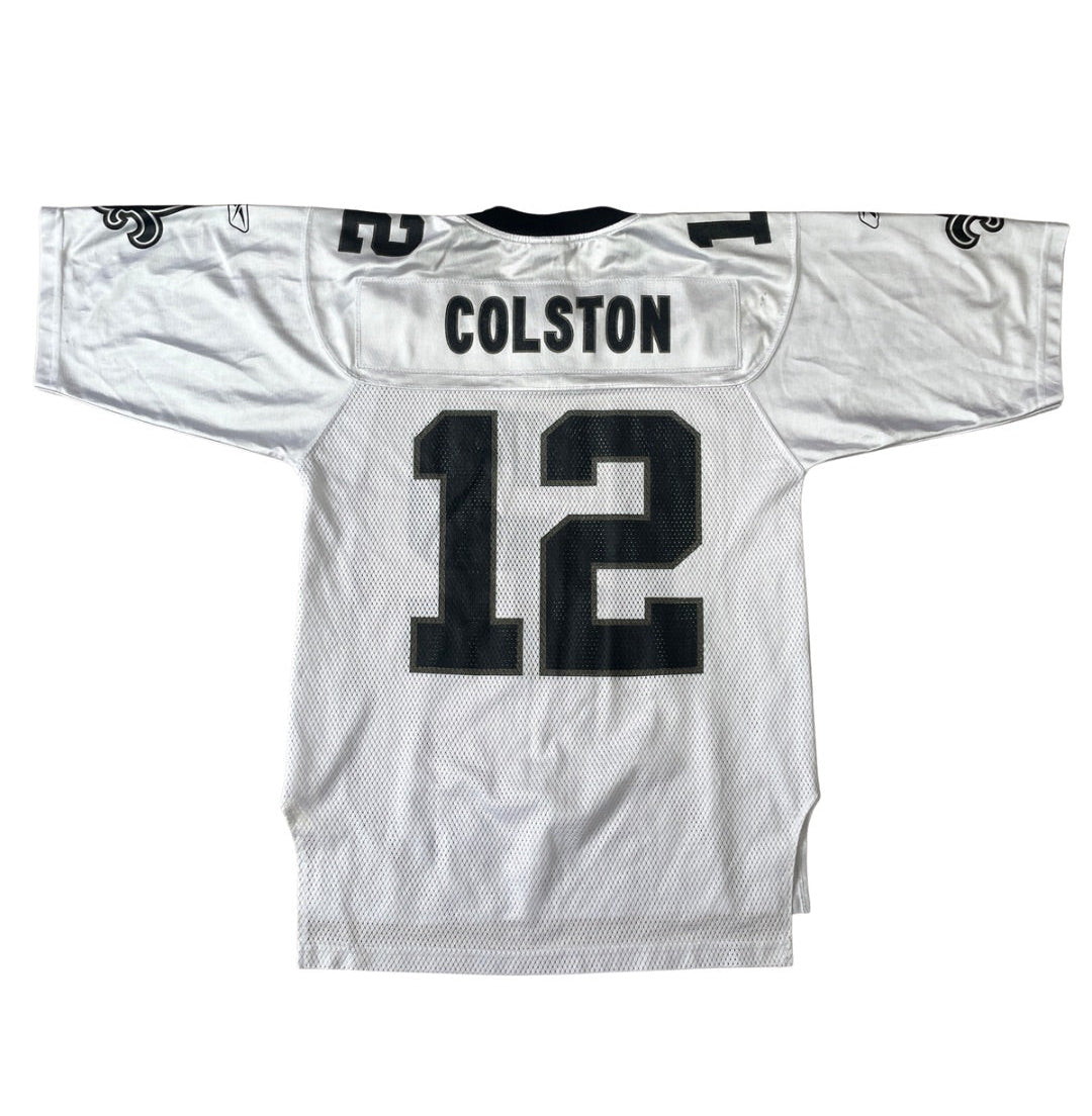 A white Dallas Cowboys football jersey shown from the back, featuring 'COLSTON' and the number '12' in black on the back collar and upper back.